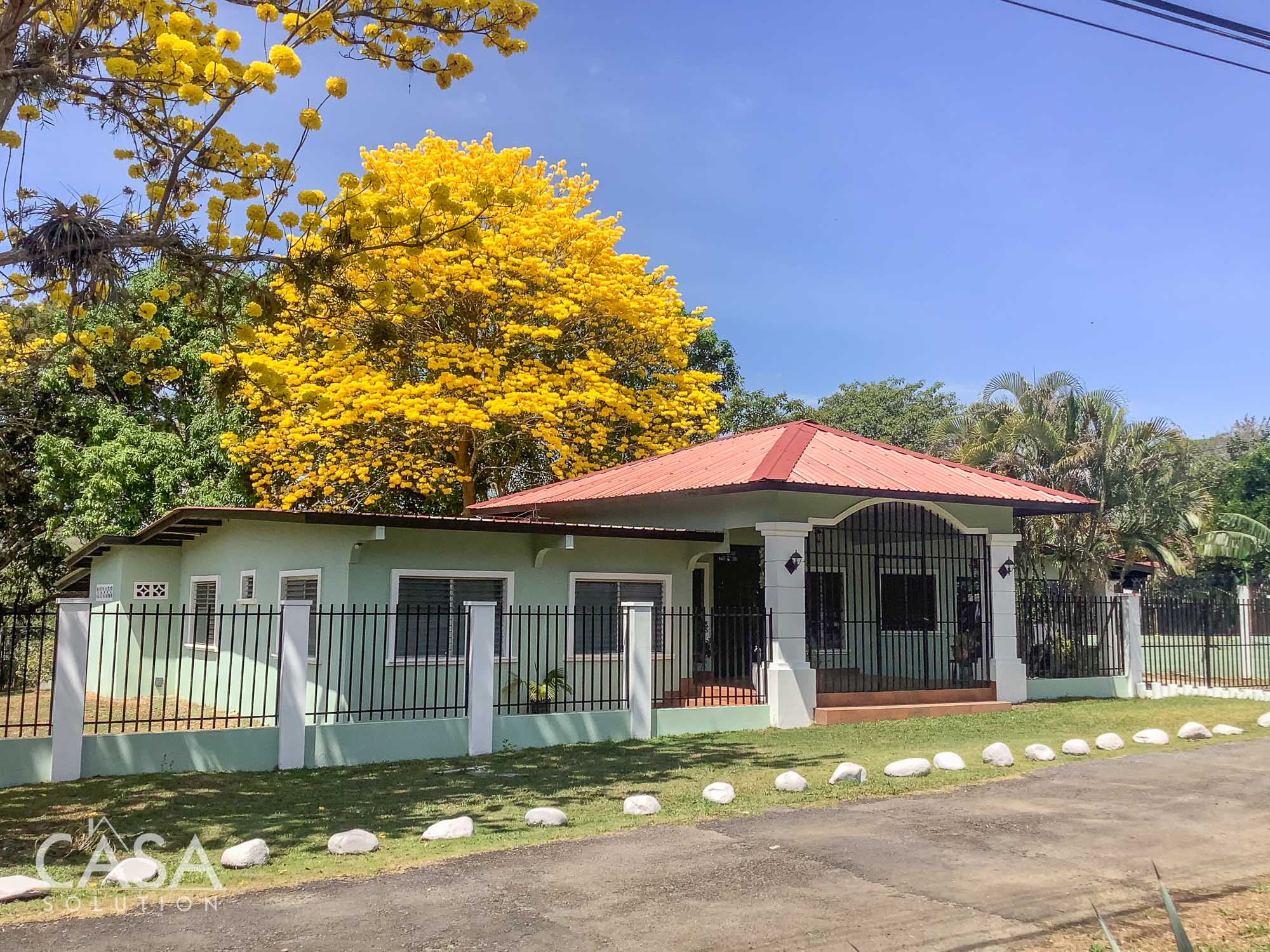 Inviting Property for Sale in Los Algarrobos Just a 10-minute Drive from David, Chiriqui. Featuring Lush Landscaping, Rustic Elegance, and a Covered Terrace.