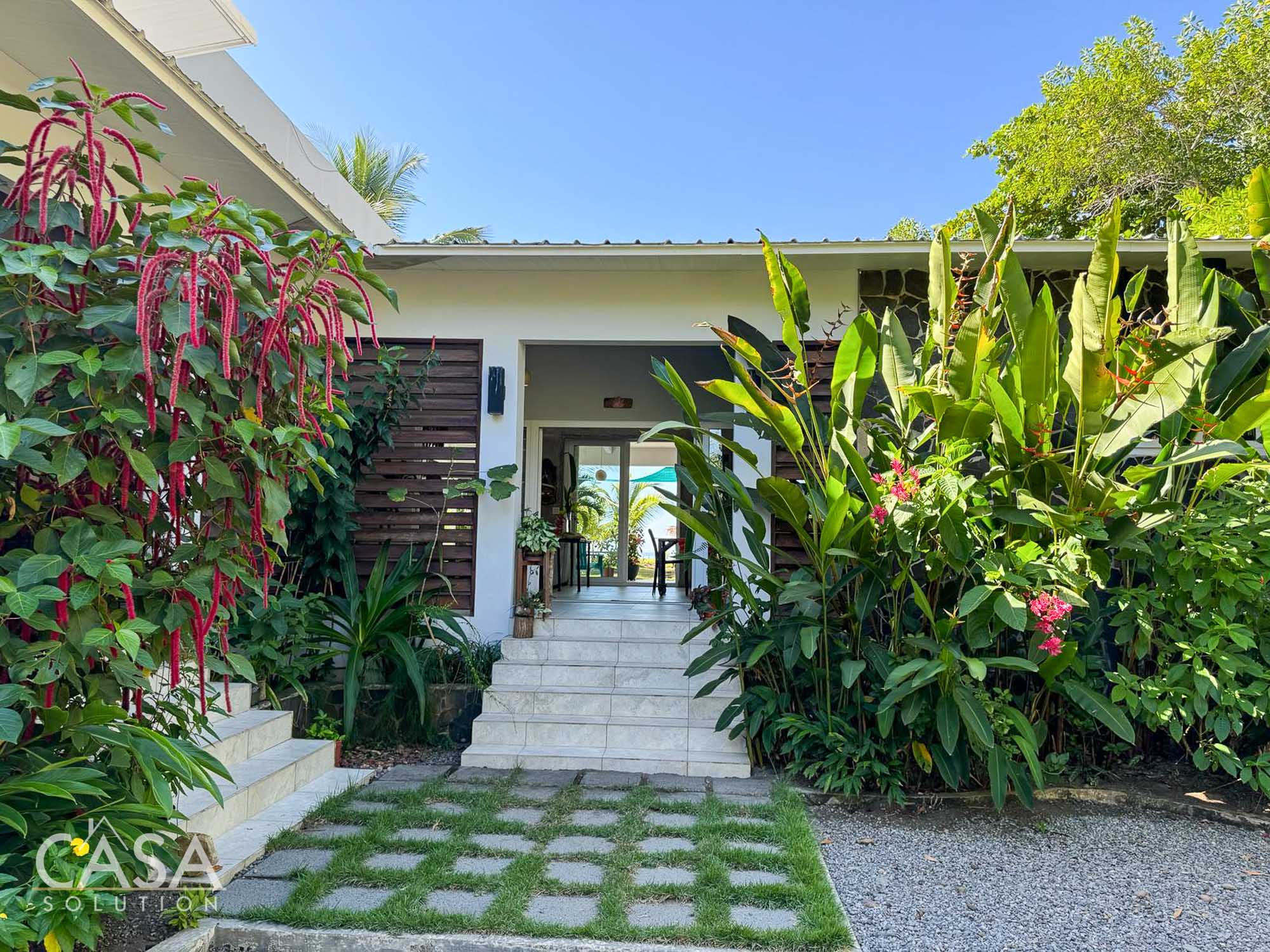 Contemporary Beachfront Home with Two Master Bedrooms for Sale Amidst Tropical Landscaping in Las Lajas, Chiriqui Beaches