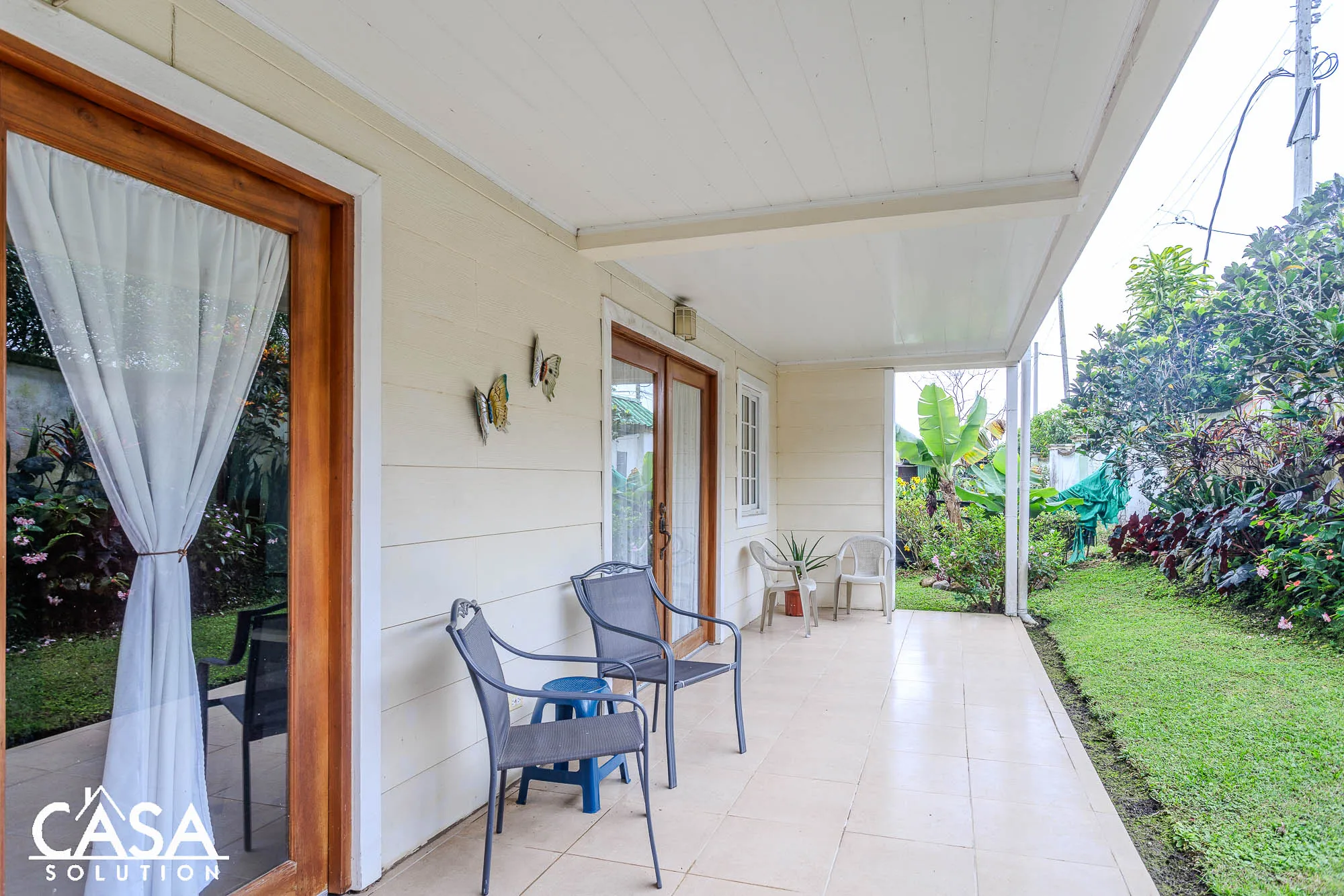 2-bedroom Ground Floor Condo for Sale in Valley of Flowers, Boquete, featuring a private patio