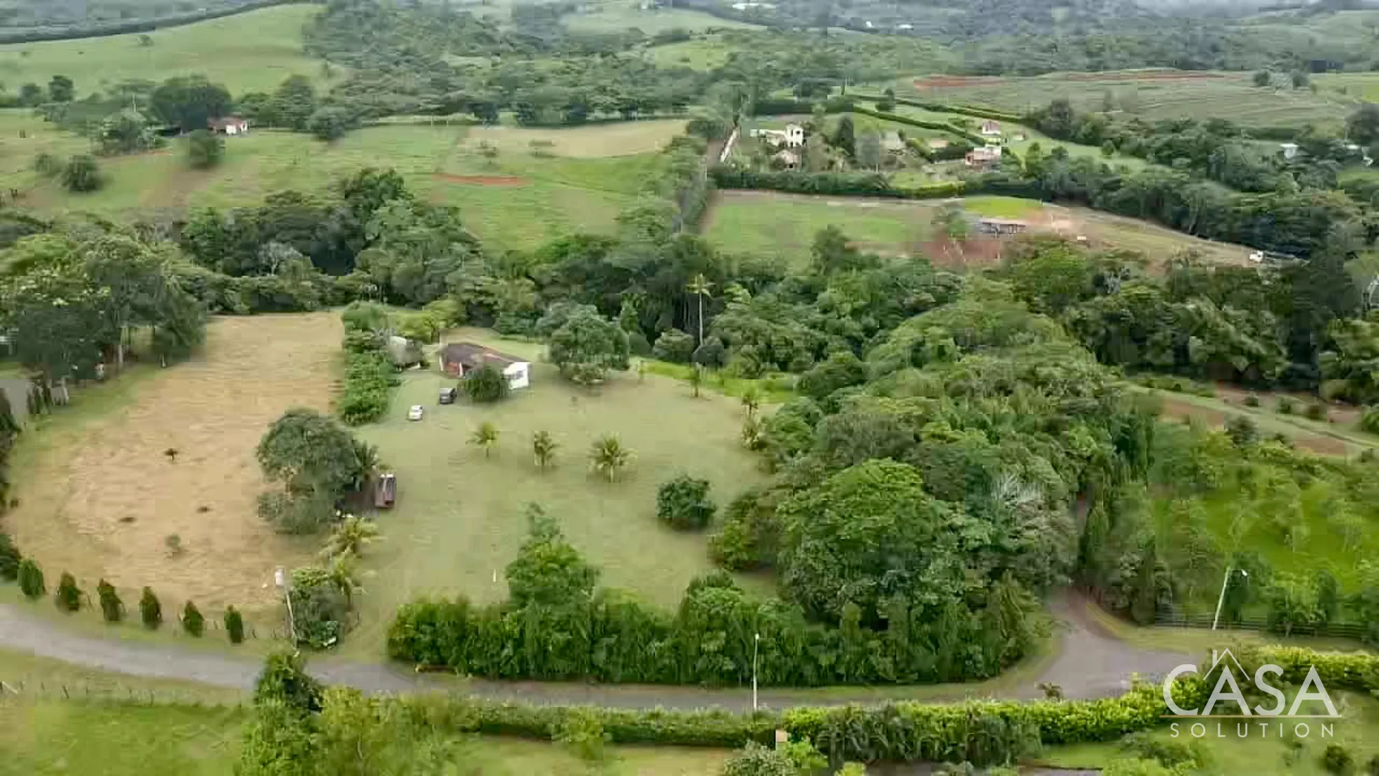 Large property with fruit trees, a home, and construction materials for sale in Hacienda San Domenica, La Chorrera