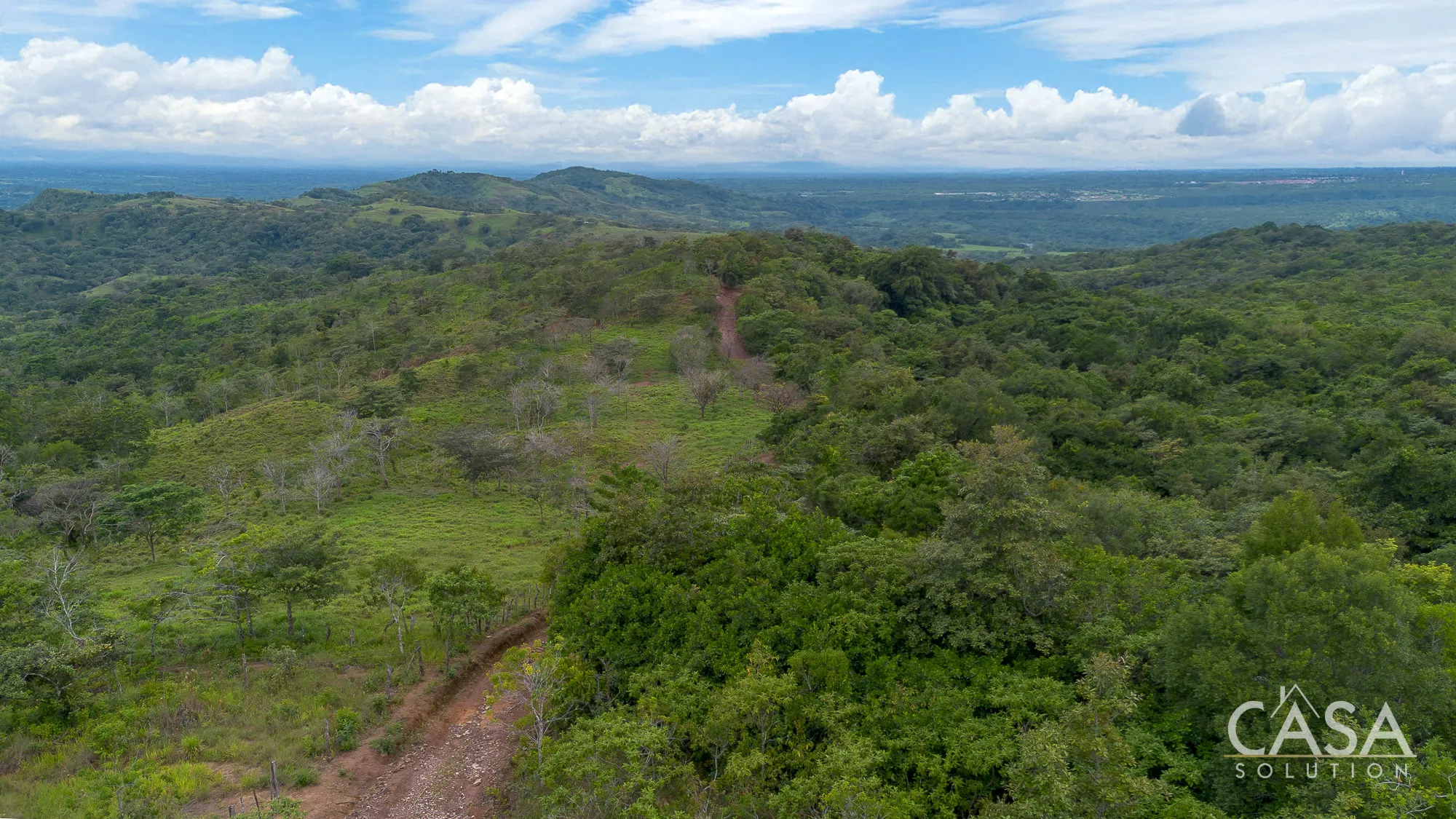 3 hectares of wooded land for sale in El Paso, Boquete. Features a mix of terrain, mountain views, natural stream, and off-grid potential just 16 km from town